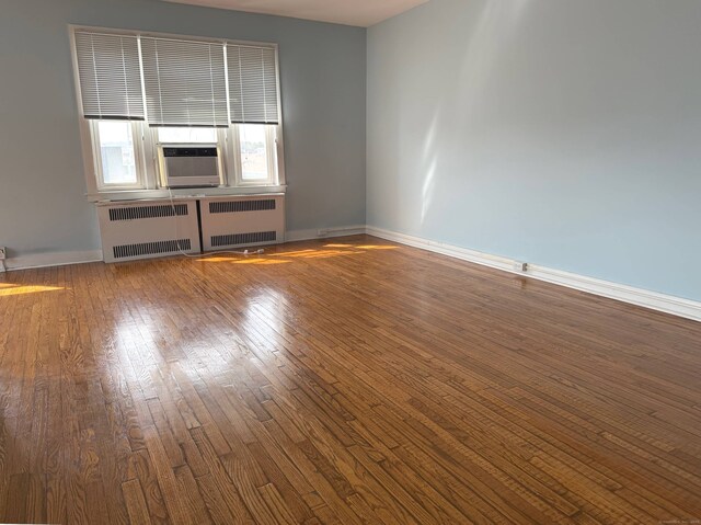 70 Strawberry Hill Ave Apt 3-3B, Stamford, CT 06902 - unfurnished room featuring hardwood / wood-style floors and radiator