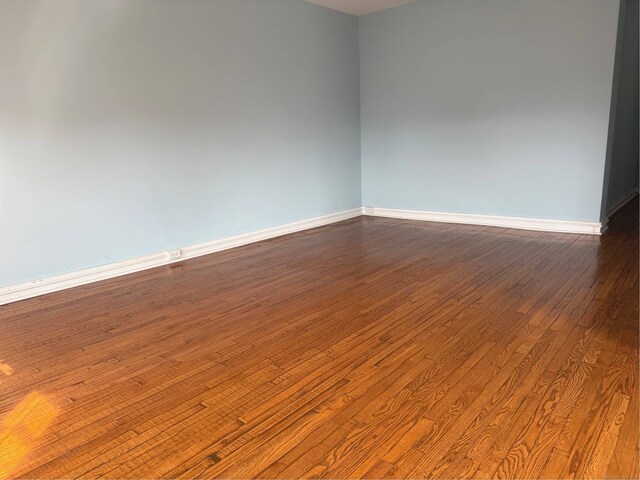 70 Strawberry Hill Ave Apt 3-3B, Stamford, CT 06902 - spare room featuring baseboards and dark wood finished floors