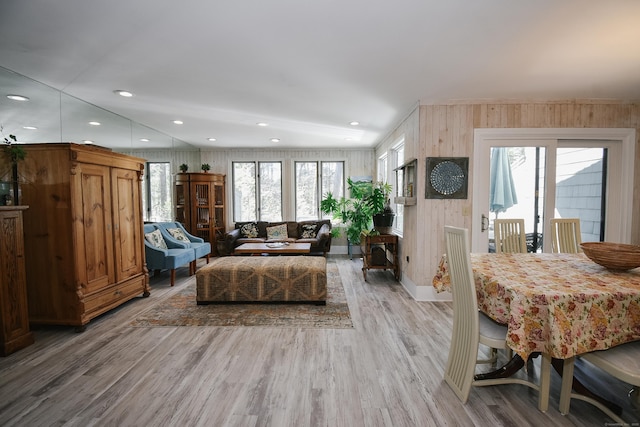 living room featuring light wood-type flooring, a wealth of natural light, and recessed lighting