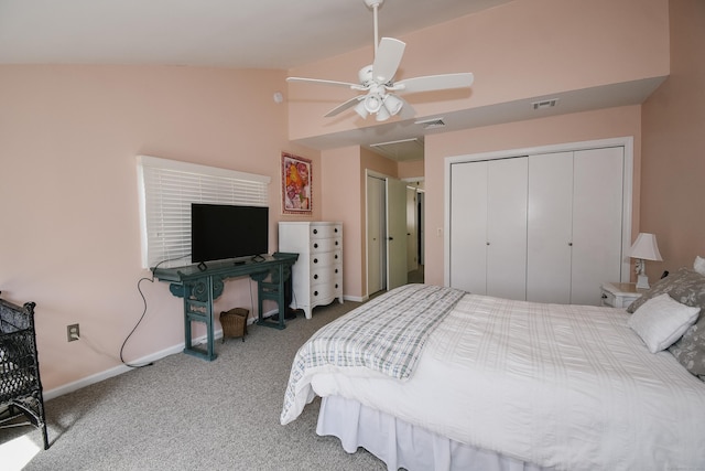 carpeted bedroom with multiple closets, lofted ceiling, visible vents, and baseboards