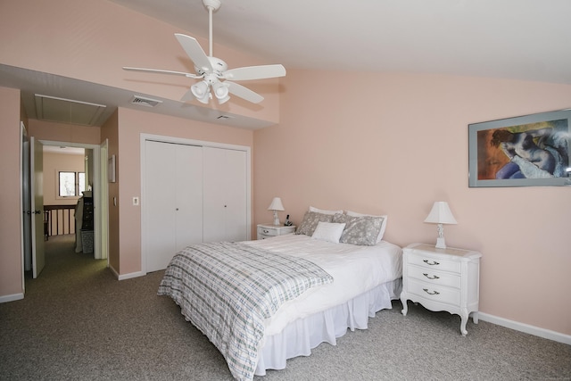 bedroom with carpet floors, visible vents, vaulted ceiling, a closet, and attic access