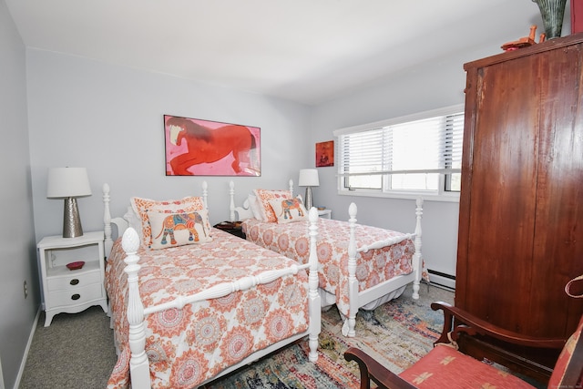 carpeted bedroom with baseboards and a baseboard heating unit