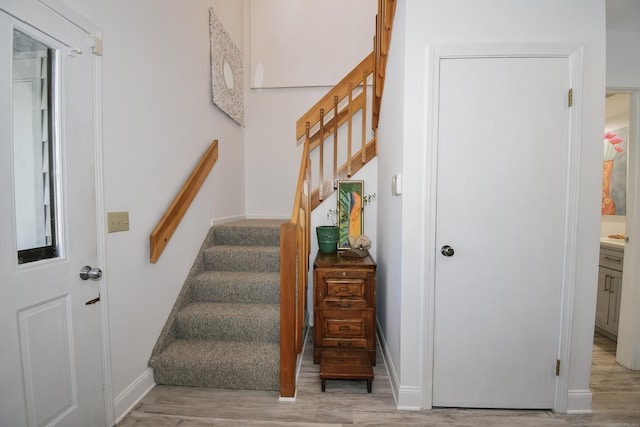 interior space with wood finished floors and baseboards