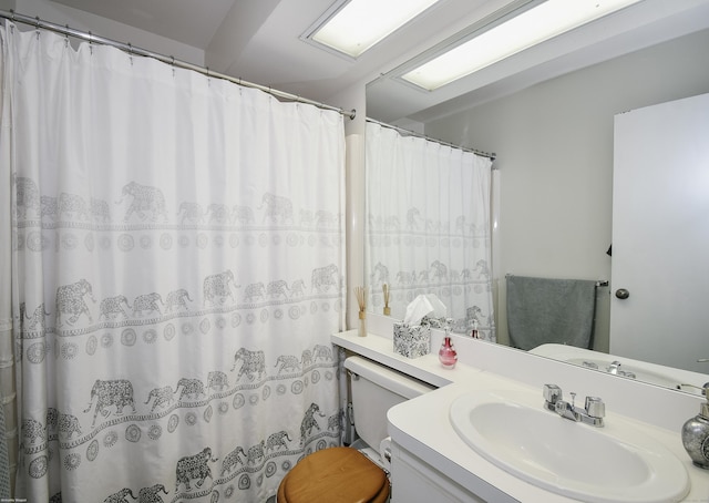 bathroom featuring vanity and toilet