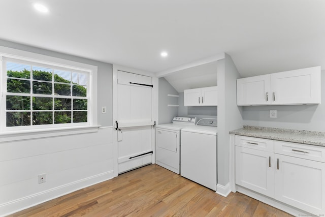 laundry area featuring light wood finished floors, recessed lighting, cabinet space, a baseboard heating unit, and washer and dryer