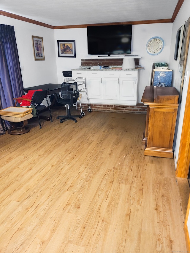 home office featuring ornamental molding and wood finished floors