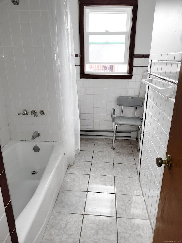 bathroom with tile patterned flooring, wainscoting, tile walls, and baseboard heating