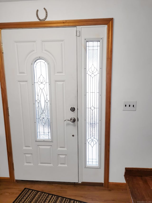 foyer entrance with wood finished floors