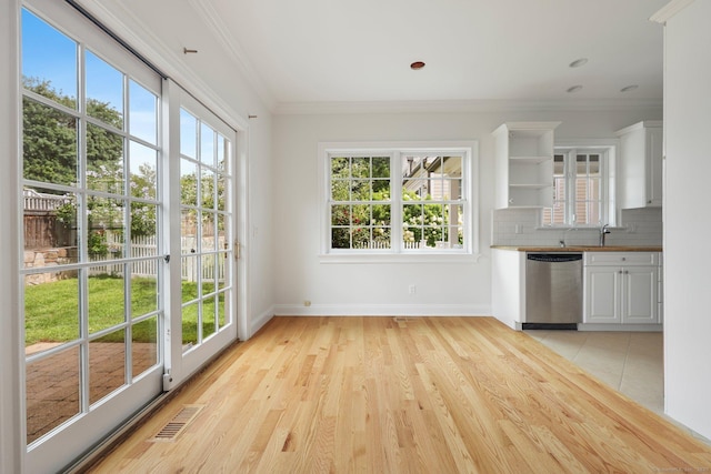 kitchen featuring visible vents, ornamental molding, stainless steel dishwasher, decorative backsplash, and open shelves