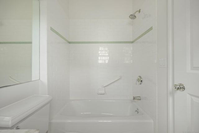 bathroom featuring toilet and washtub / shower combination