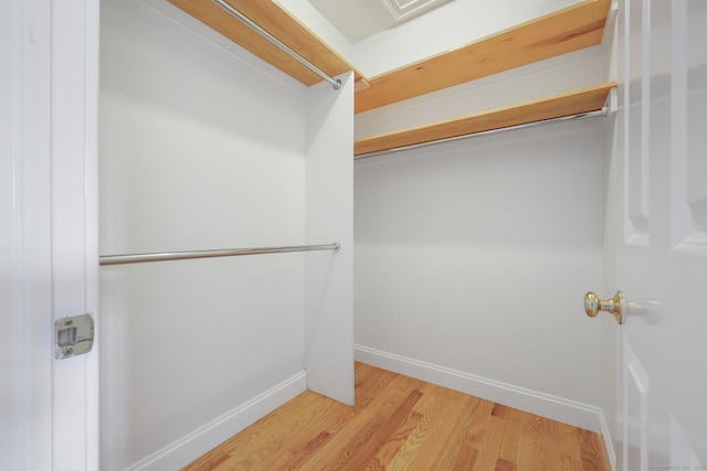 spacious closet with light wood-style flooring