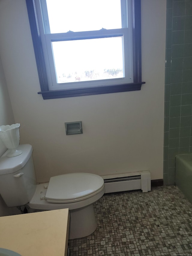 bathroom featuring a tub, toilet, baseboard heating, and walk in shower