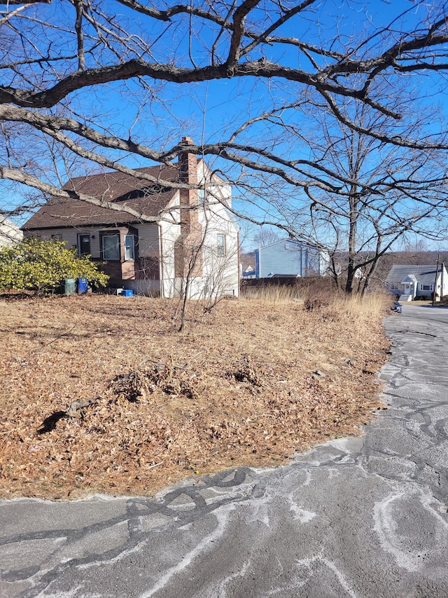 view of home's exterior with a chimney