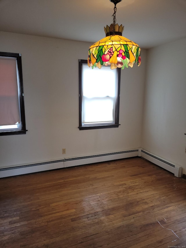 unfurnished room with wood finished floors