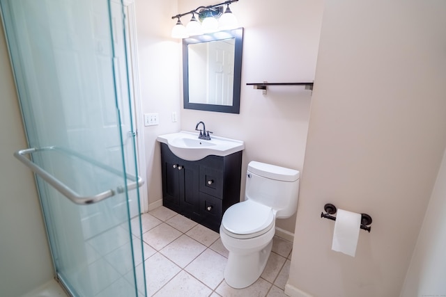 full bath featuring toilet, a shower stall, vanity, and tile patterned flooring