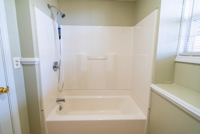 bathroom with bathing tub / shower combination