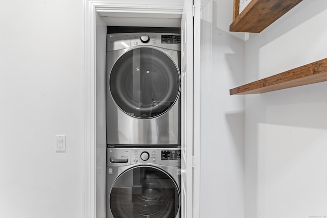 laundry area with laundry area and stacked washer and clothes dryer