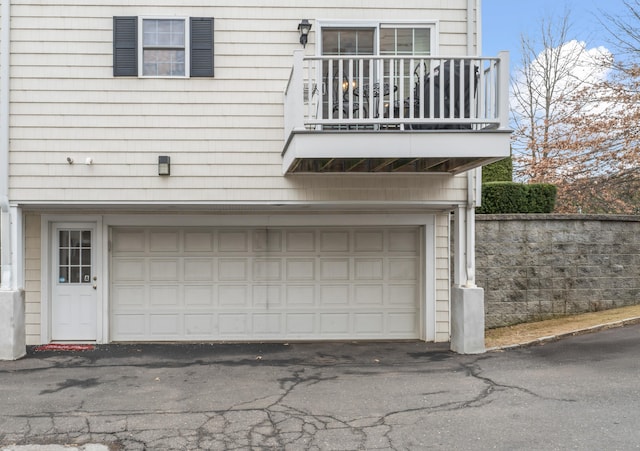 garage featuring aphalt driveway