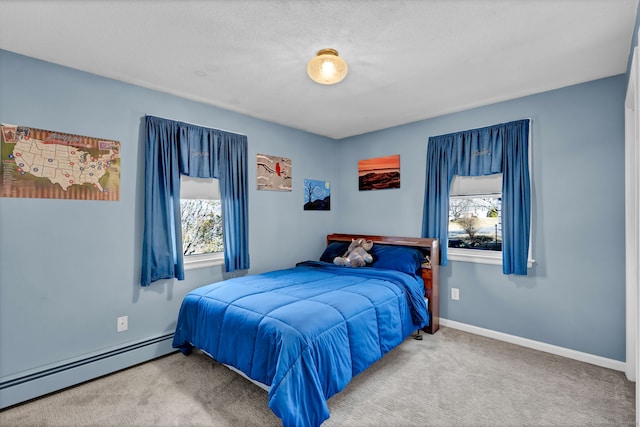 bedroom featuring carpet, baseboards, and baseboard heating