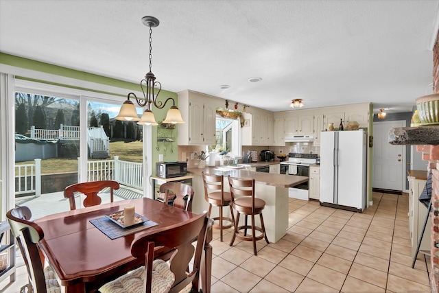 dining area with light tile patterned flooring