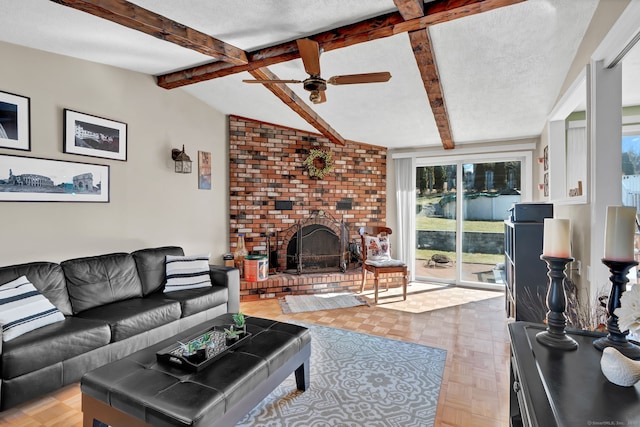 living room featuring lofted ceiling with beams, a brick fireplace, a ceiling fan, and a textured ceiling