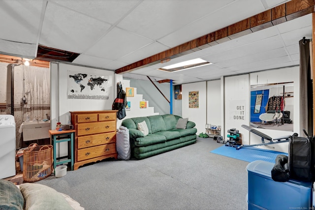 interior space featuring washer / dryer, stairway, and a drop ceiling