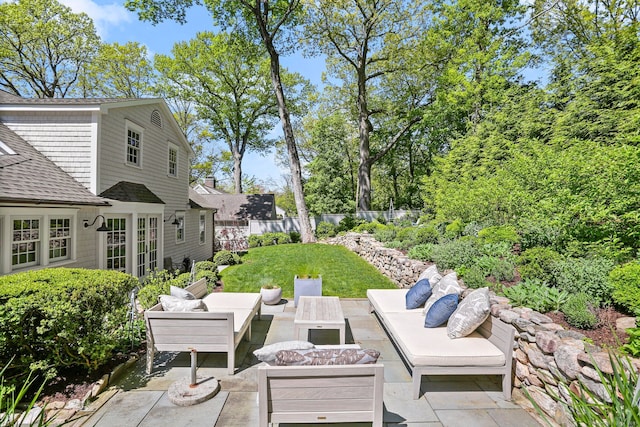 view of patio with fence and an outdoor living space