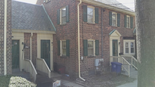 view of front of property featuring brick siding