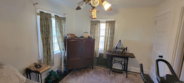 misc room featuring baseboards, ornamental molding, and ceiling fan