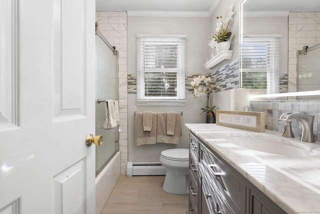 bathroom with crown molding, decorative backsplash, toilet, baseboard heating, and vanity