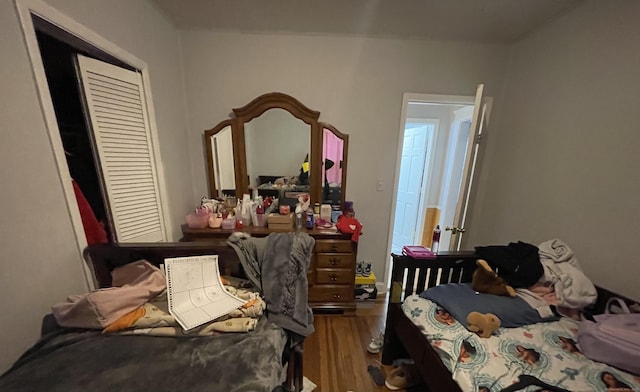 bedroom with wood finished floors