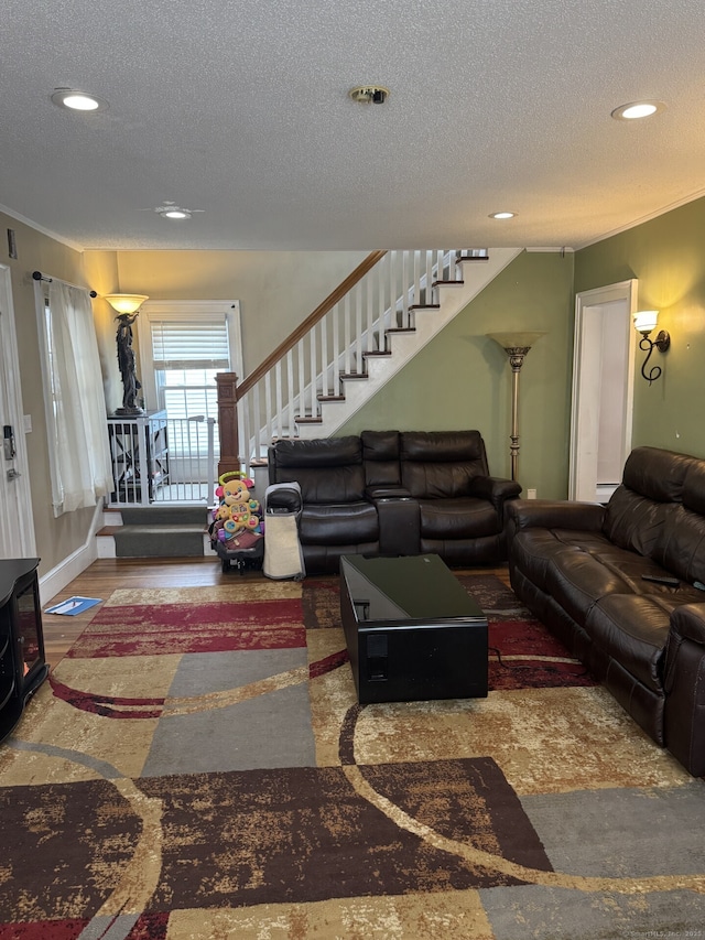 living room with recessed lighting, stairway, a textured ceiling, wood finished floors, and baseboards