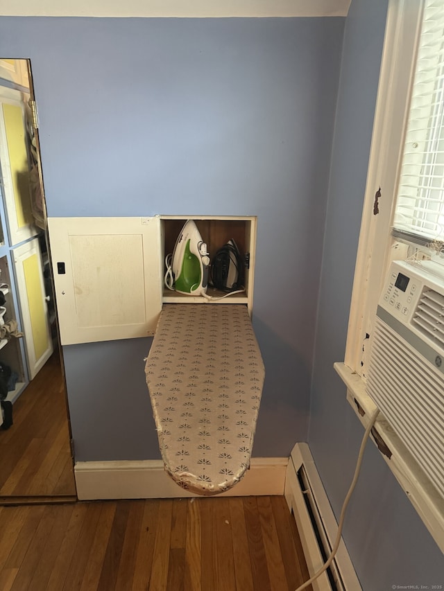 interior space featuring a baseboard radiator and wood finished floors