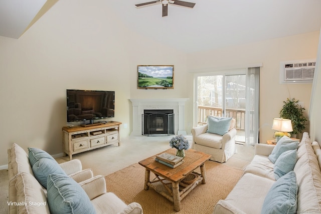 carpeted living room featuring a high end fireplace, ceiling fan, high vaulted ceiling, a wall mounted air conditioner, and baseboards