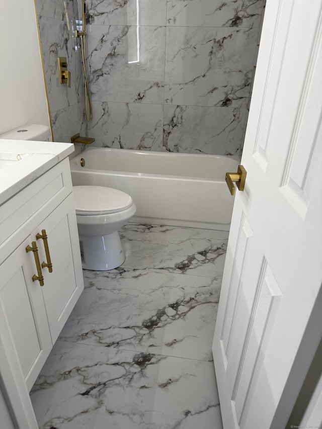 bathroom with toilet, marble finish floor, shower / tub combination, and vanity