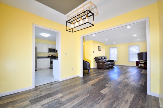 interior space featuring baseboards, dark wood-style flooring, and recessed lighting