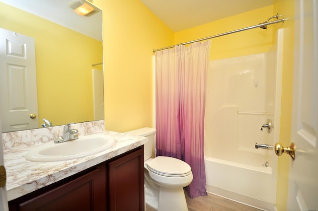 full bath with shower / bathtub combination with curtain, vanity, toilet, and wood finished floors