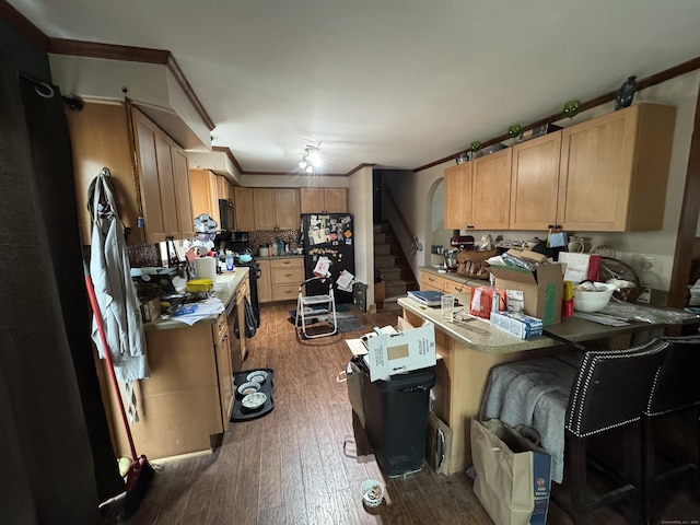 kitchen featuring a peninsula, dark wood-type flooring, ornamental molding, backsplash, and freestanding refrigerator