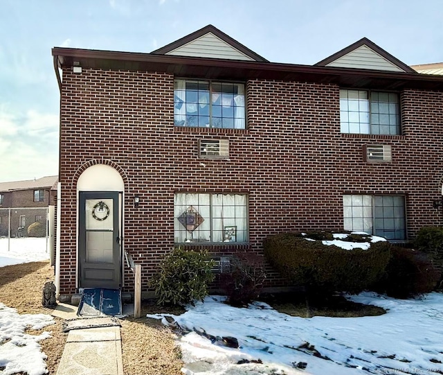 view of front of house featuring brick siding