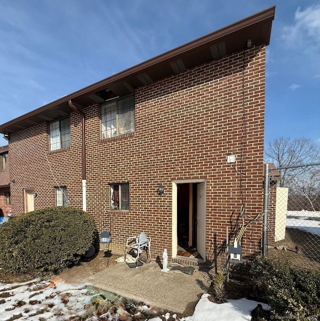 view of property exterior featuring brick siding