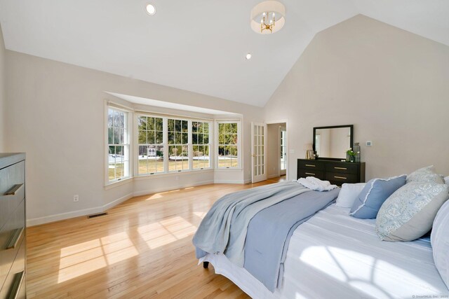 bedroom with visible vents, high vaulted ceiling, recessed lighting, light wood finished floors, and baseboards