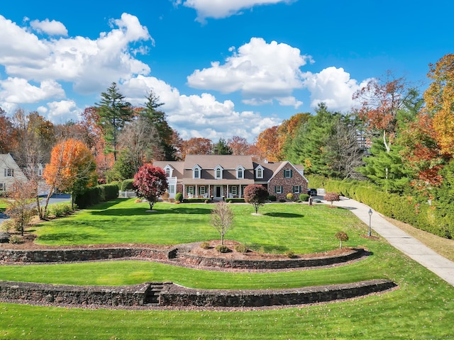 back of property featuring a lawn