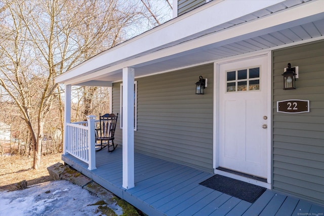 view of exterior entry featuring a porch