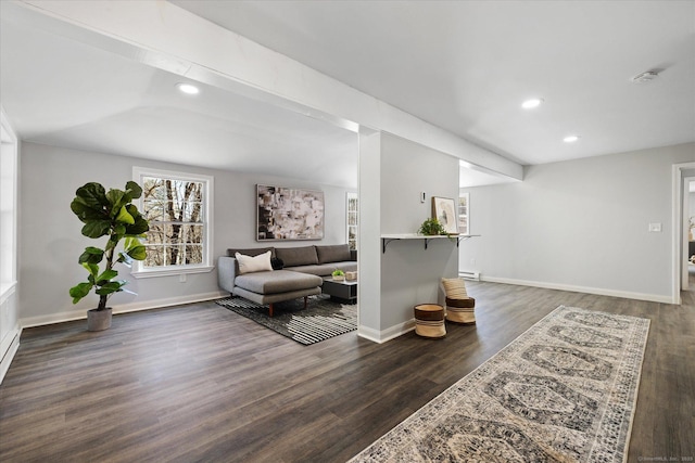 sitting room with baseboards, wood finished floors, and recessed lighting