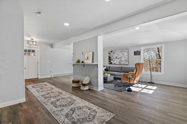 interior space featuring baseboards, baseboard heating, wood finished floors, and recessed lighting