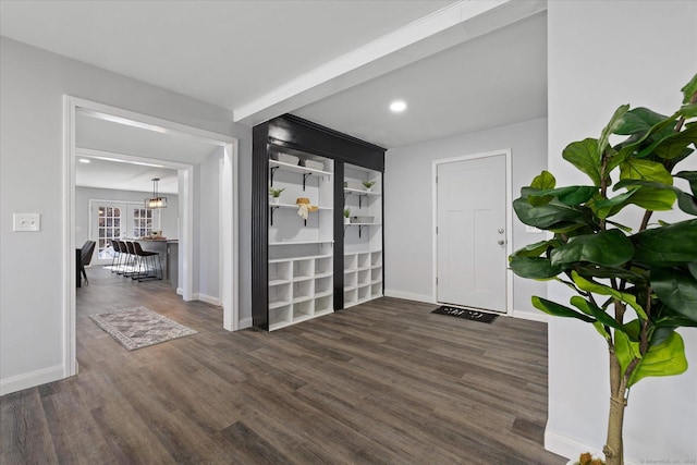 foyer with recessed lighting, wood finished floors, and baseboards