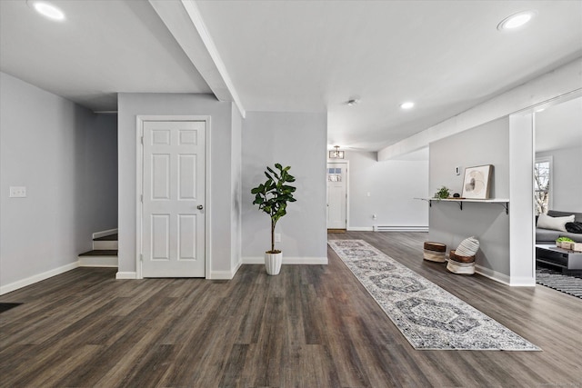 entryway featuring recessed lighting, a baseboard radiator, wood finished floors, and baseboards