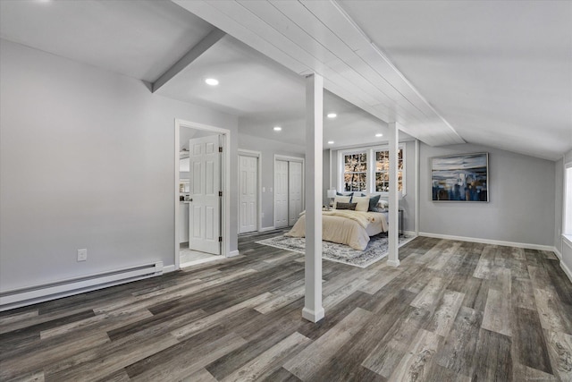 interior space featuring lofted ceiling, recessed lighting, a baseboard heating unit, wood finished floors, and baseboards