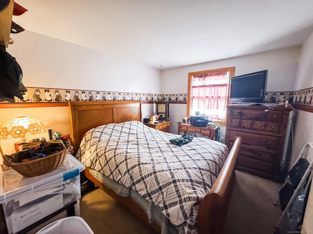 bedroom with a wainscoted wall