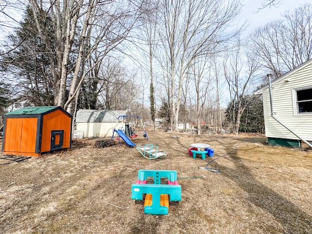 exterior space with a shed and an outbuilding